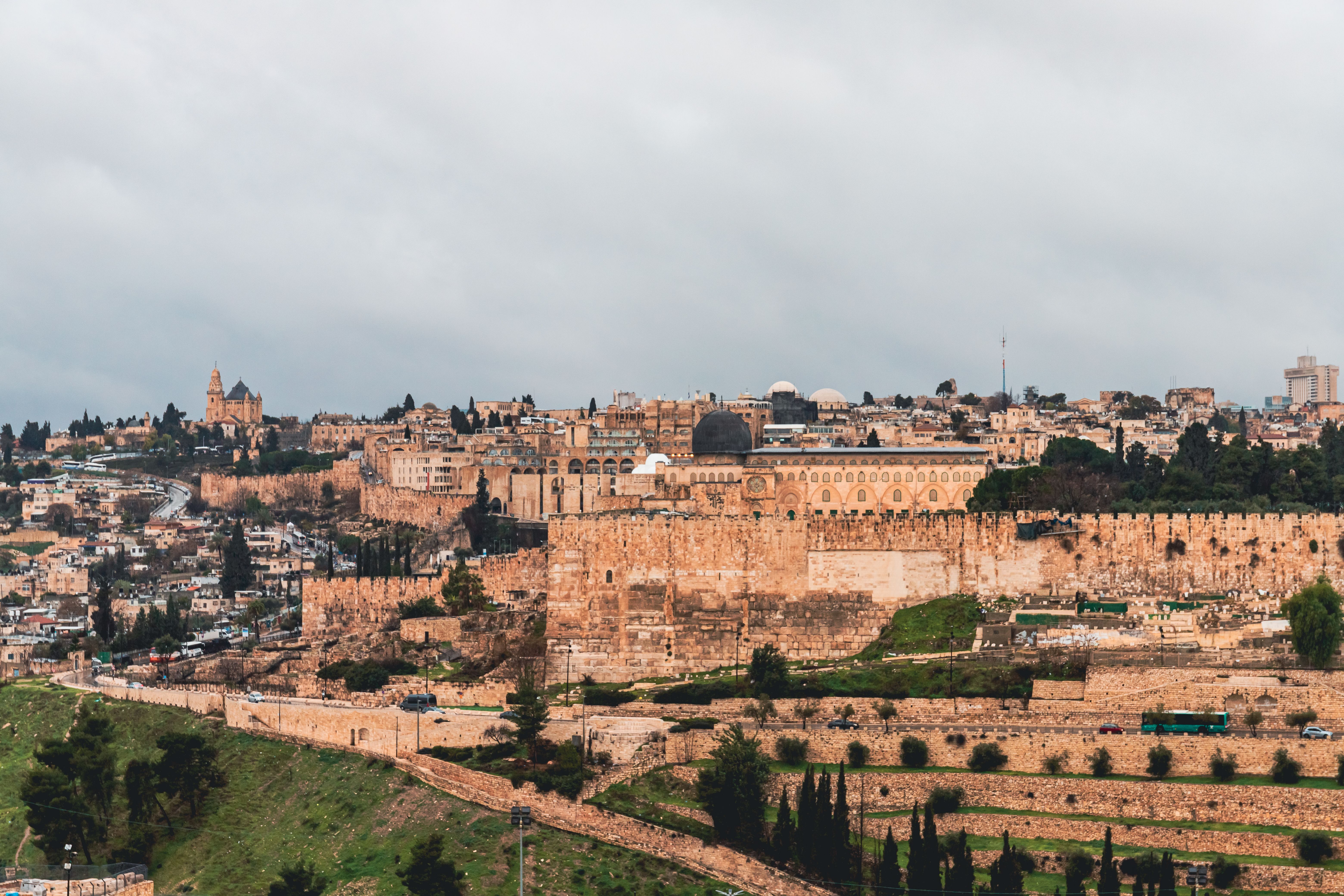 The honey-colored stone walls of Jerusalem's Old City seen across the valley from the Mount of Olives