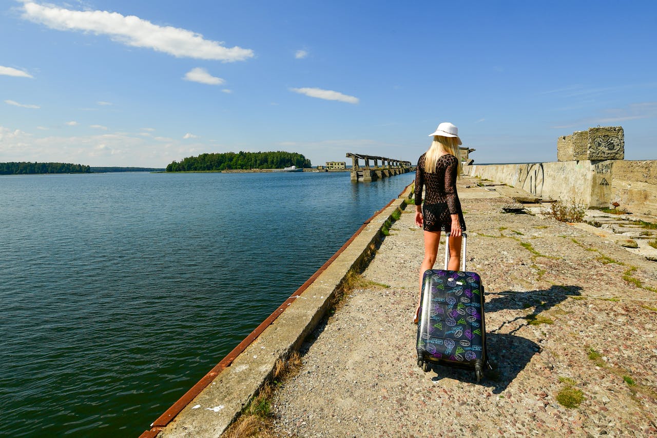 why-choose-us A traveler enjoys a sunny day exploring Estonia, the kind of memorable stop a well-planned ministry travel itinerary includes.