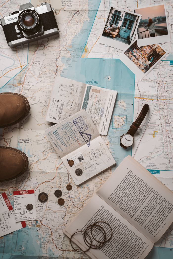 gallery-6 Travel essentials including a map, camera, and passport stamps, ready for your next ministry travel adventure.