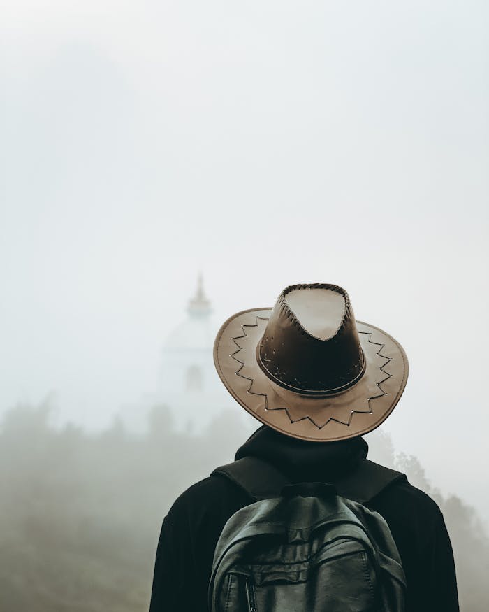 services-03 A solitary traveler looks toward a misty temple, capturing the sense of adventure that ministry travel inspires.